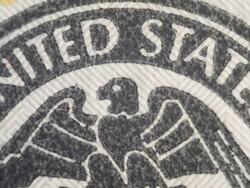 Extreme close up of the Federal Reserve System symbol on the $100 bill Stock Footage