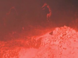 Chunks of rock fall off cliff into boiling lava lake, Marum Volcano, Ambrym Island, Vanuatu Stock Footage
