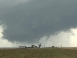 WS ZO View of developing tornado swirls above steel barn / Tillman County, Oklahoma, United States Stock Footage