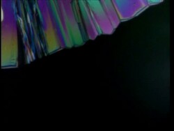 T/L CU colourful crystals grow across frame Stock Footage