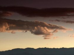 "Dramatic orange tipped clouds on blue sky with silhouetted mountain range behind, Amazonas region of Peru [PerÃƒÂº]" Stock Footage