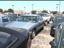 Consumers and new car dealers may be raving about "Cash for Clunkers," the government program that is giving a lift to the auto industry, but others are pointing to its negative effects. The AP's Rich Matthews explains. News Clip