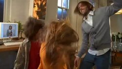 MS, Father with two children  (8-9,10-11) shaking heads and dancing at home Stock Footage