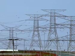 T/L Traffic on highway surrounded by electricity pylons / Dubai, United Arab Emirates Stock Footage