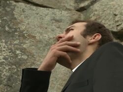 Business man climbs mountain Stock Footage