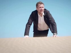 Businessman in desert Stock Footage