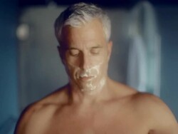 MS Man cleaning shaving cream with towel in hotel room  / Seattle, WA, United States Stock Footage