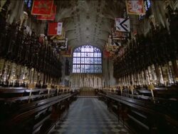 St Georges Chapel Windsor with banners of current Knights of the Order of the Garter, Berkshire, England, UK Stock Footage
