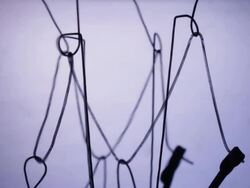 Timelapse close up zoom into an electric light bulb filament flickering on and off Stock Footage