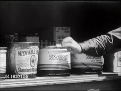 1947: STANDARD OIL (INDIANA): SALESMEN: Salesman 'George Meyn' on sales call at cannery, MS taking cans of lubricant out of truck. 'George Meyn' walking w/ hose from truck to home, placing hose nozzle into fuel oil tank opening outside home. Instructional Video