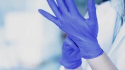 Scientists are wearing chemical resistant gloves, Slow motion Stock Footage