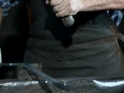 HD Super Slow-Mo: Blacksmith Cutting Steel Stock Footage