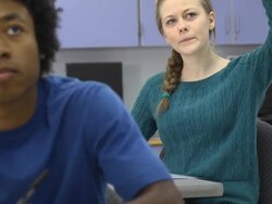 Confident Female Student Interacts in Classroom Setting Stock Footage