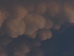 CU Shot of orange mammatus clouds with lightning / Henrietta, Texas, United States Stock Footage