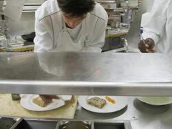 POV food being prepared at the plating area in a restaurant kitchen Stock Footage