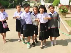 MS POV SLO MO Childrens walking in  schoolyard  / Vientiane, Laos Stock Footage