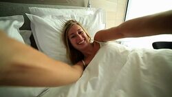 Blond girl takes selfie in bed Stock Footage