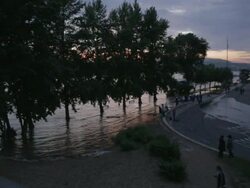 Street corner next to the River Danube at the start of a flood Stock Footage
