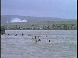 Waves breaking over sea wall, flooded train track, flood in Towyn, Wales, UK Stock Footage