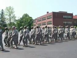Soldiers marching in Queens school yard Stock Footage