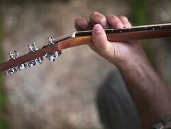Acoustic guitarist playing chords, close-up Stock Footage