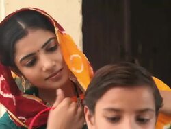 Woman combing her daughter, Faridabad, Haryana, India  Stock Footage