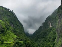 T/L cloud over Tal Side Valley, Himalayas Stock Footage