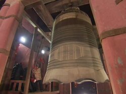 Men Ringing Bell in Beijing News Clip