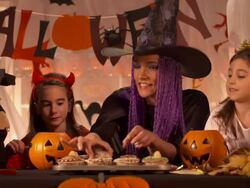 HD DOLLY: Elementary Students Eating Halloween Pastries Stock Footage