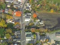 MS AERIAL View of town with autumn color trees / Maine, United States Stock Footage