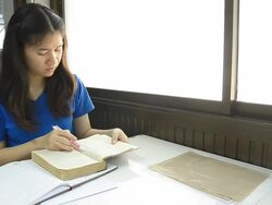Thai girl student suddenly screen to read book Stock Footage