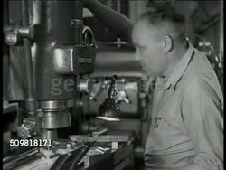 1944: JONES & LAMSON MACHINE CO.: BOEING SUB CONTRACT: INT VS Factory workers operating machines. CU Sign 'Chief Engineer.' MS Two engineers looking over papers at desk. MS Man opening cabinet marked 'Post-War' taking folder out. Springfield, Vermont. Instructional Video