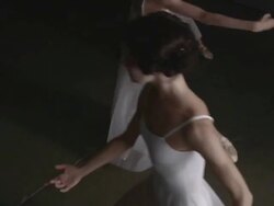 Three ballerinas performing arabesque Stock Footage