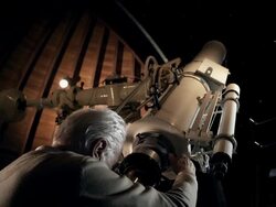 Old man in observatory Stock Footage