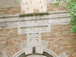 MS Sign over entrance of abandoned elementary school Stock Footage