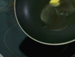 CU Butter melting in pan Stock Footage