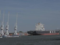 WS View of cranes,freighter & barge / Antwerp, Belgium Stock Footage