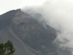 Cloud and steam swirl from the top of Merapi volcano; Central Java, Indonesia. 28 October 2010 Stock Footage