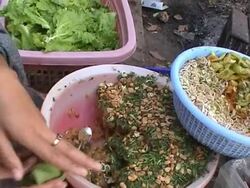 Food preparation at market, Vietnam Stock Footage