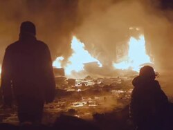 Protesters in front of burning vans Stock Footage