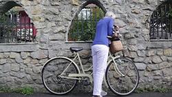 Woman with dog on bicycle Stock Footage