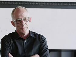 MS mature businessman standing arms crossed in discussion Stock Footage