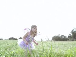 MS TS Girl searching ladybugs in grassy field / Los Angeles, California, United States  Stock Footage