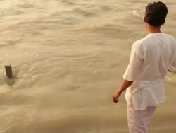 Man doing aarti of river Ganges, Haridwar, Uttarakhand, India Stock Footage