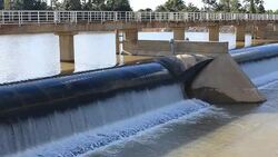 Flowing water at small dam Stock Footage