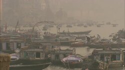 Boats crowd a river in India. Stock Footage