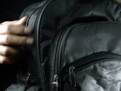 unzip and pick the book Stock Footage