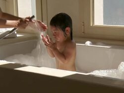MS Shot of mother rinse little girl hair in bath / Marbella, Andalusia, Spain Stock Footage