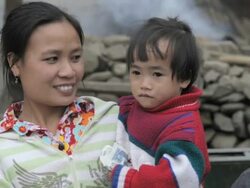 MS mother holding child / Xam Neua, Laos Stock Footage