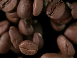 Coffee Beans Over Black Background (Super Slow Motion) Stock Footage